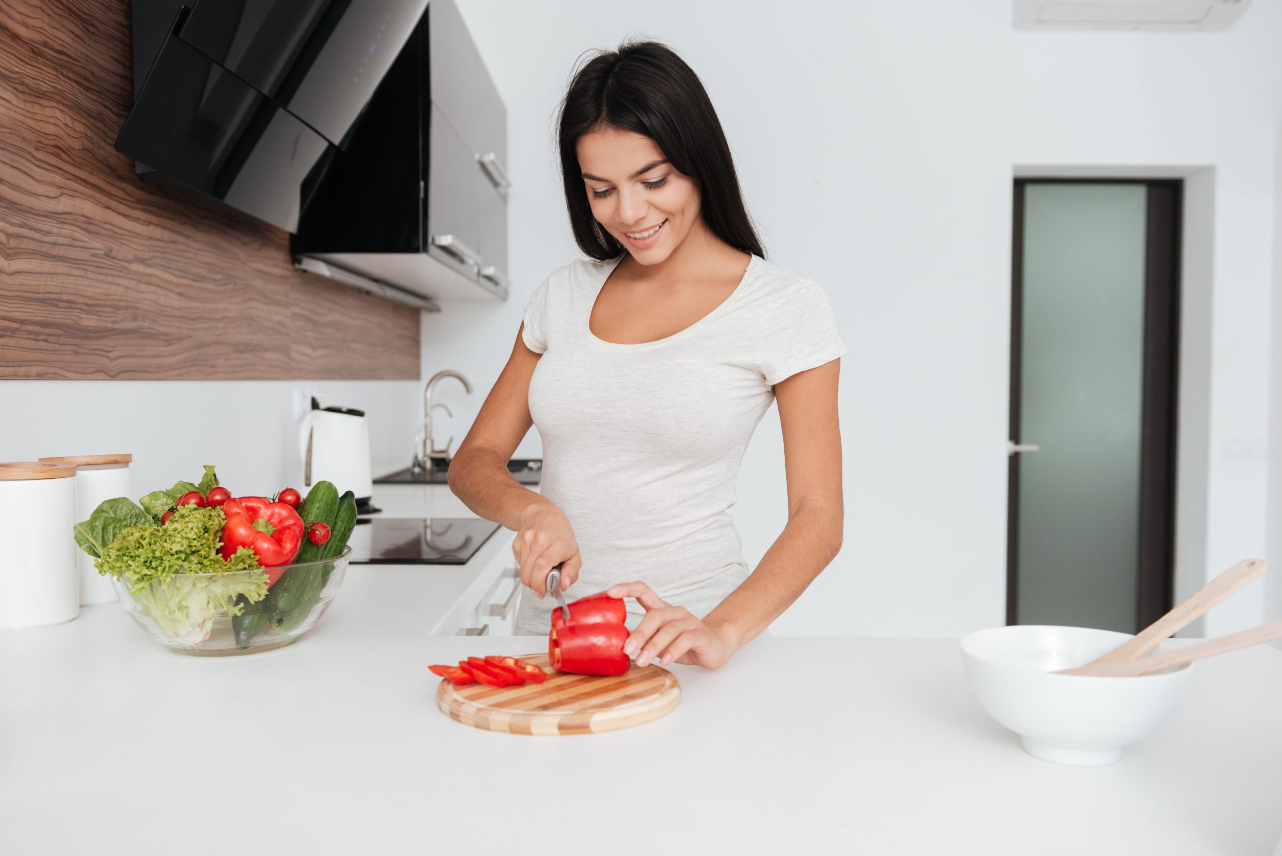 Young Woman Cooking in the kitchen